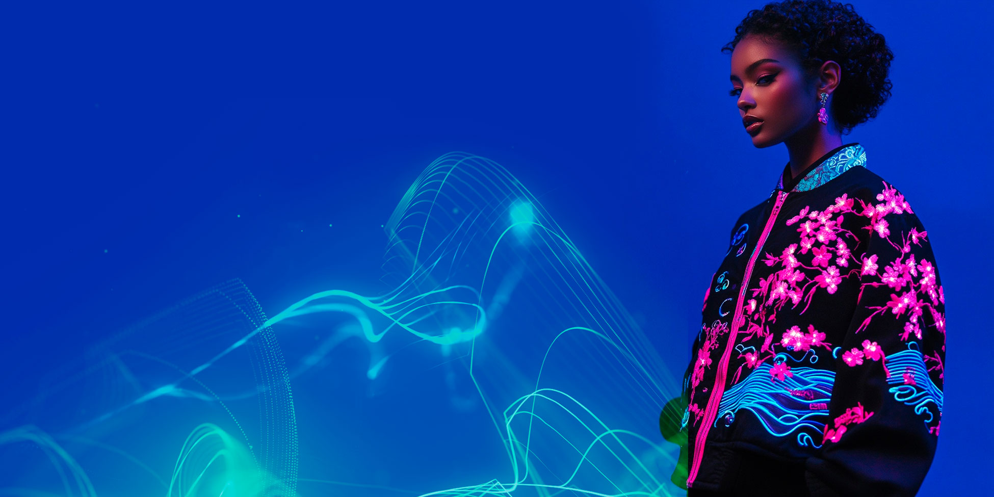 Model wearing the Sakura Circuit jacket against a deep blue backdrop