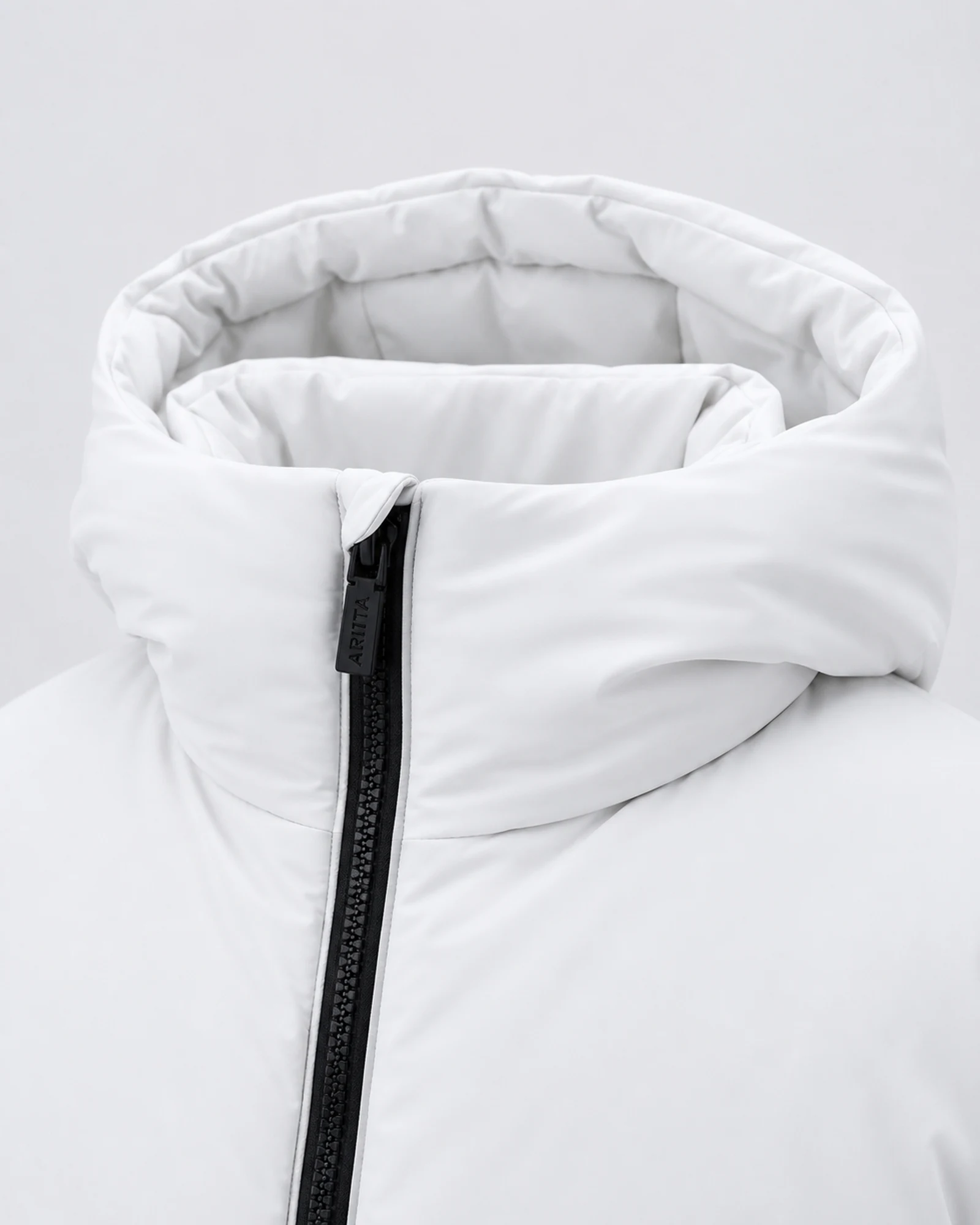 Detail of the padded collar and black ARITTA zip