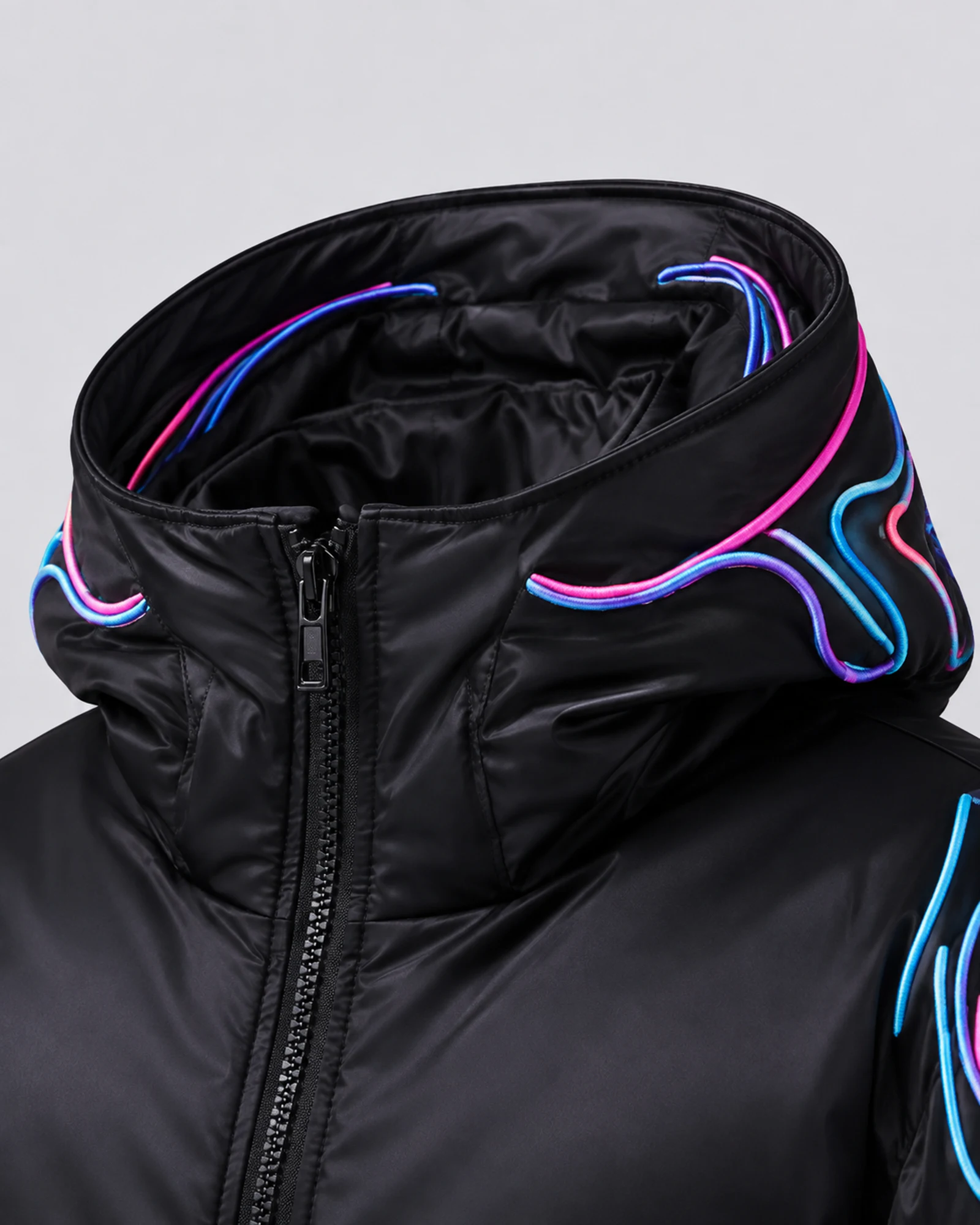 Detail of the black padded collar and neon embroidery