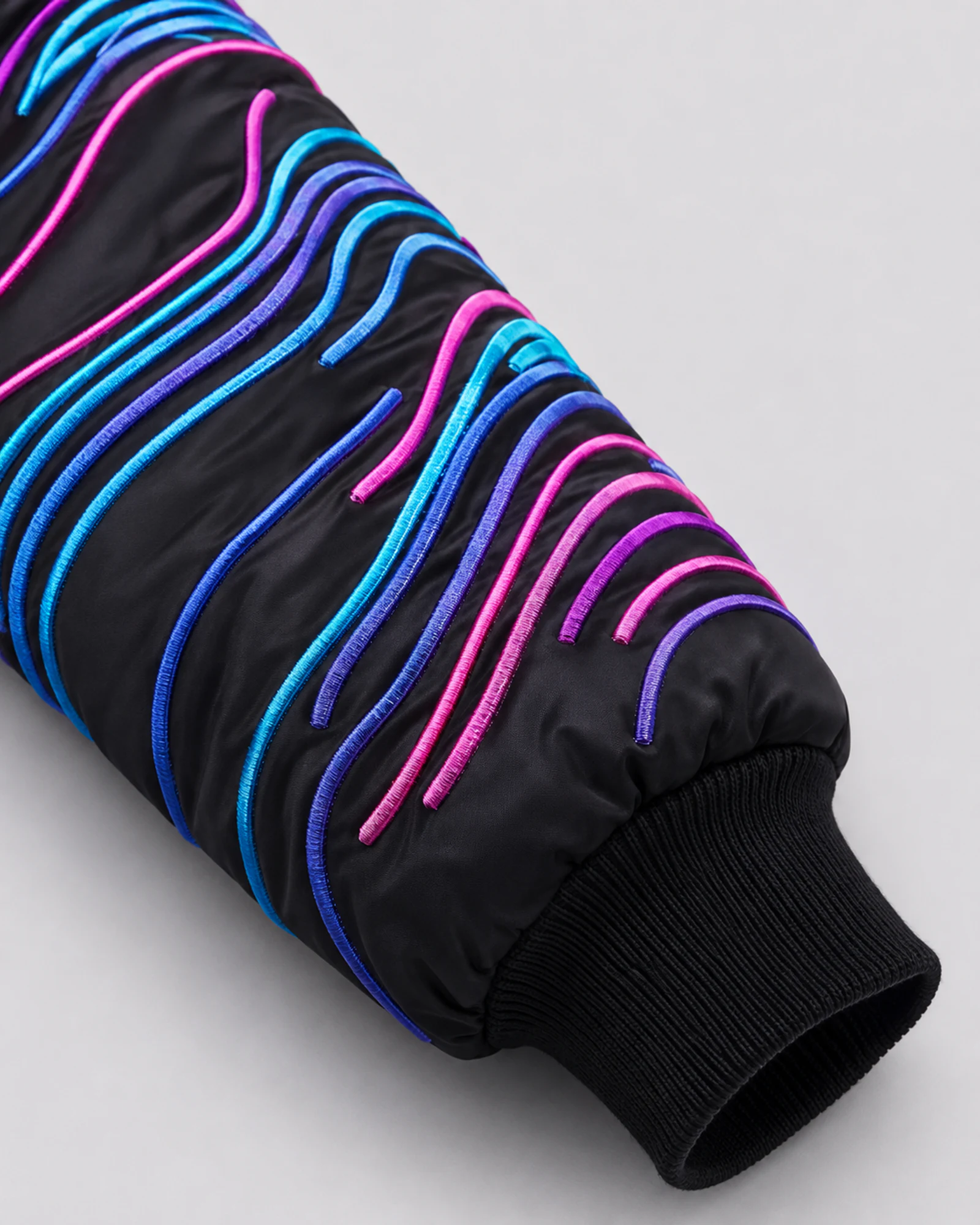 Detail of the embroidered sleeve and ribbed black cuff