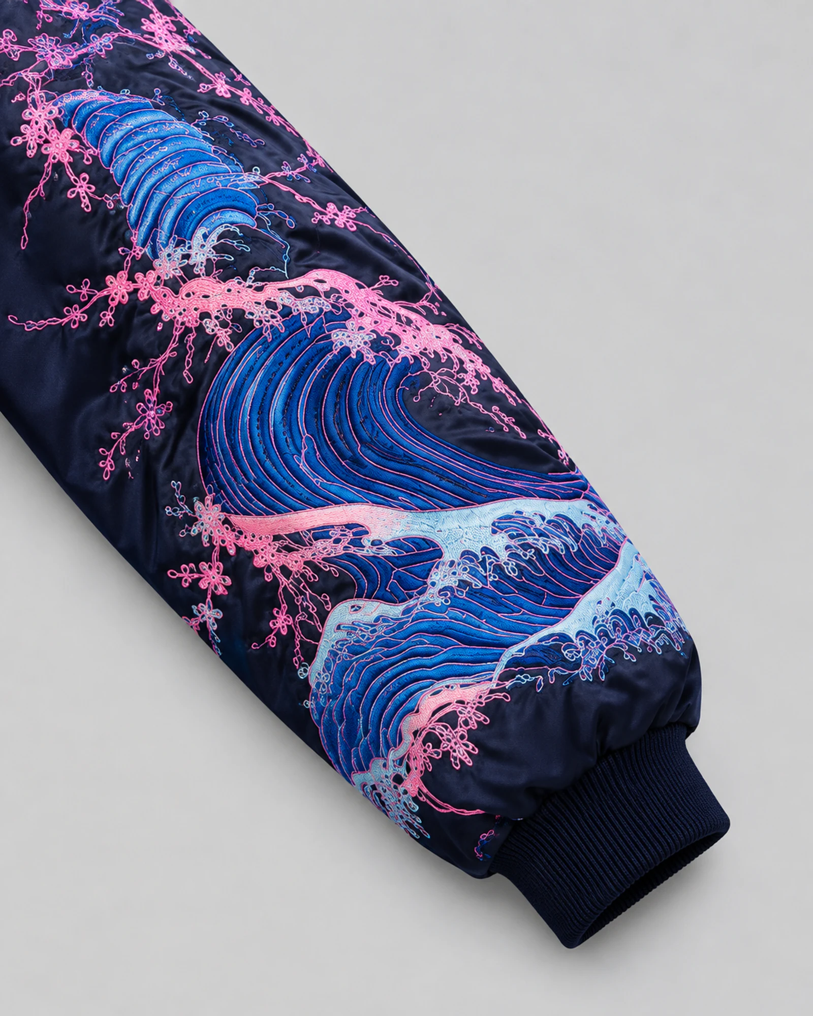 Detail of the embroidered wave sleeve and ribbed cuff