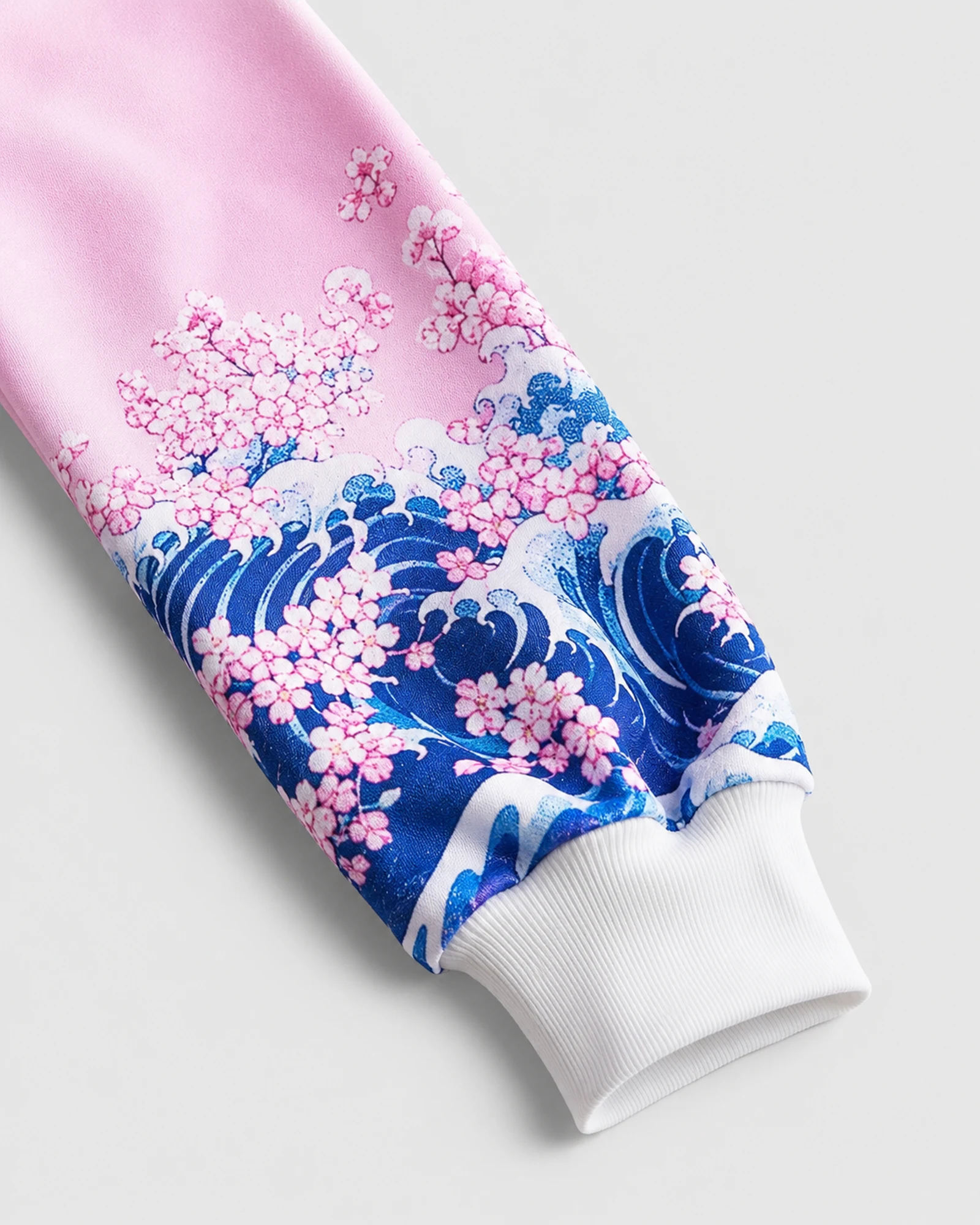 Detail of the printed pink sleeve and white ribbed cuff